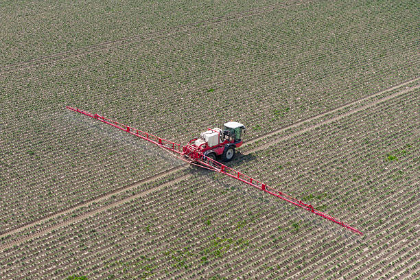 istock Agricultural crops sprayer in a field seen from above 2217088944