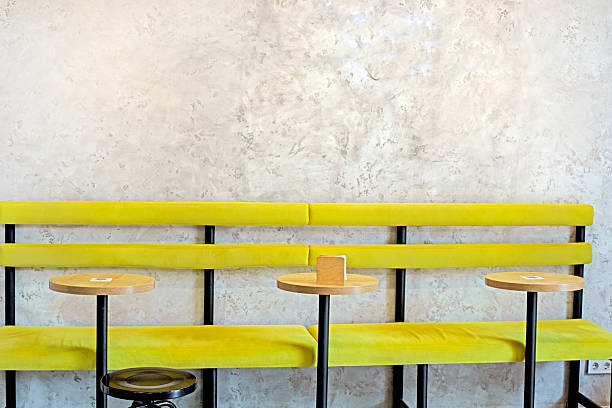 yellow stylish tables and chairs in the interior