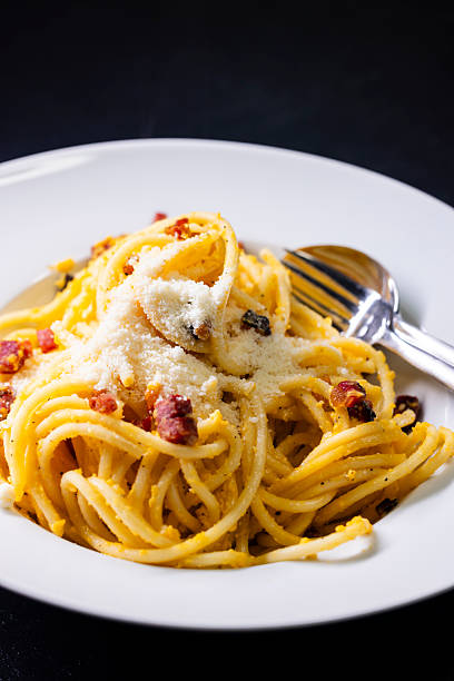 istock close up of spaghetti carbonara in white bowl 2217093647
