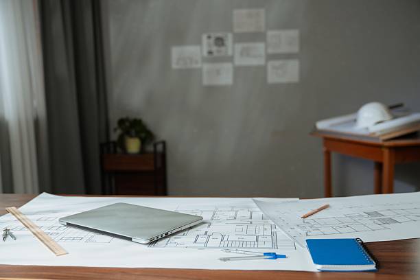 istock Architectural Blueprint with Wooden Ruler on Table 2217095846