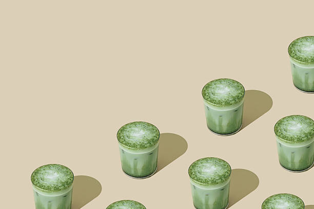 istock Creative summer pattern made of iced matcha latte on beige background with copy space. Minimal healthy matcha latte concept. Trendy drink idea. 2217099048