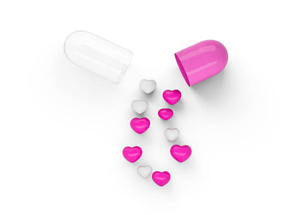 istock An Open Pink And White Glossy Capsule With Minimal Heart Shaped Pills Spilling Out 3D Illustration 2217099746