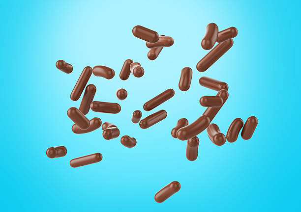 istock Chocolate Sprinkles For Cakes, Ice Cream And Desserts Falling On Cyan Background 3D Illustration 2217099764
