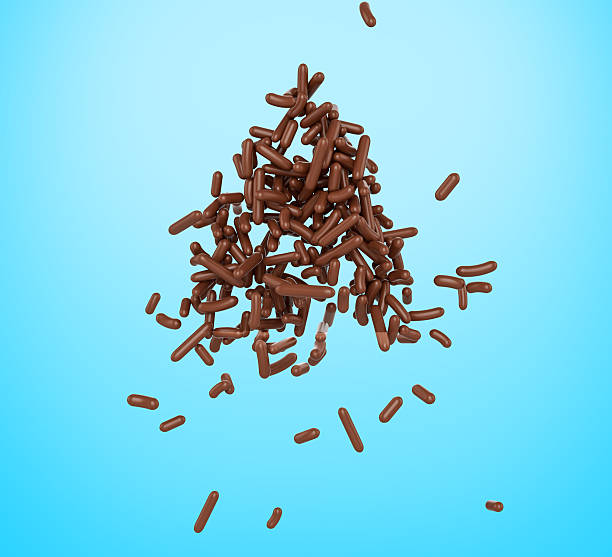 istock Group Of Chocolate Sprinkles, Cakes And Bakery Items Scattered On blue Background 3D Illustration 2217099766