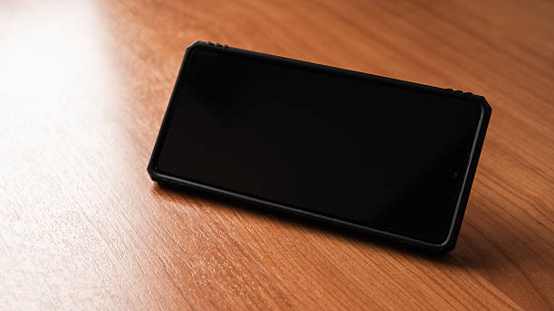 istock Smartphone wooden surface technology showcase minimalistic environment close-up view 2217103344