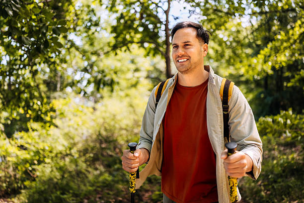 istock Young man hiking in forest 2217104373