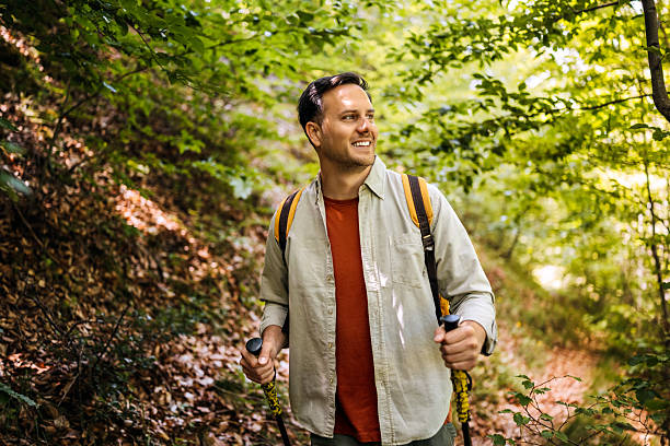 istock Young man hiking in forest 2217104805