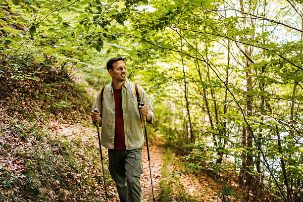 istock Young man hiking in forest 2217104808