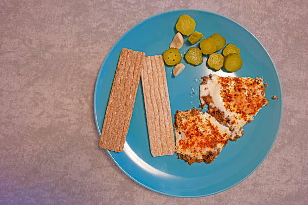 Upper View of Fried Eggs and Fresh Vegetables On plate Over Stony Grey Background As  Healthy Eating Concept. Top view. Horizontal Image Composition