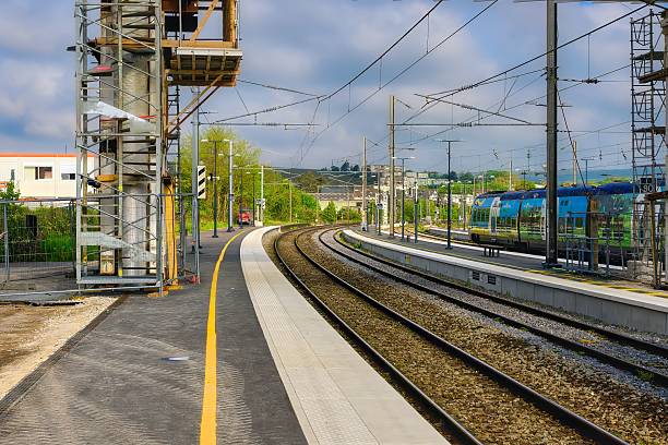istock Modern train station with curving tracks and scaffolding. 2217105359