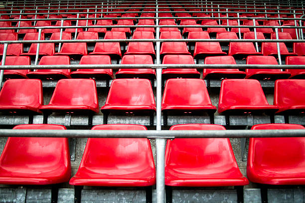 istock Empty rows of stadium seats  deserted sports venue with geometric pattern 2217108538