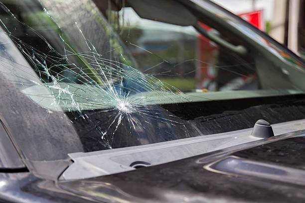 istock Car waiting for windshield replacement at auto repair shop 2217108603