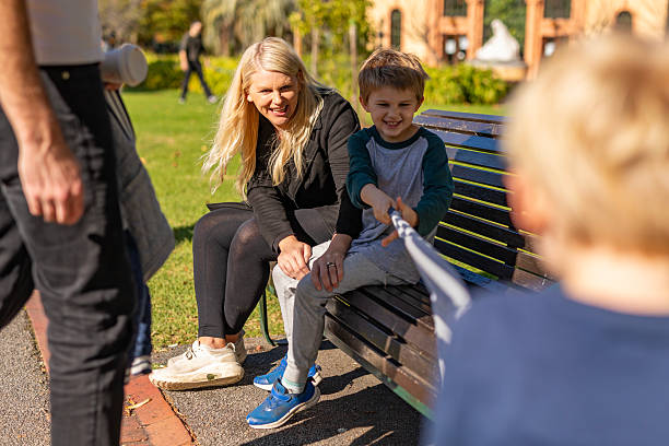 istock Young boys having fun playing tug of war together 2217108613
