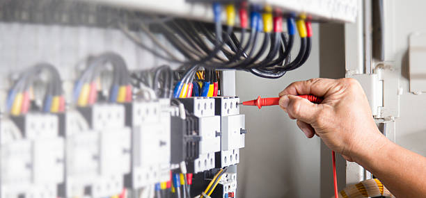 istock Electrical engineer tests the operation of the electric control cabinet on a regular basis for maintenance. 2217108715