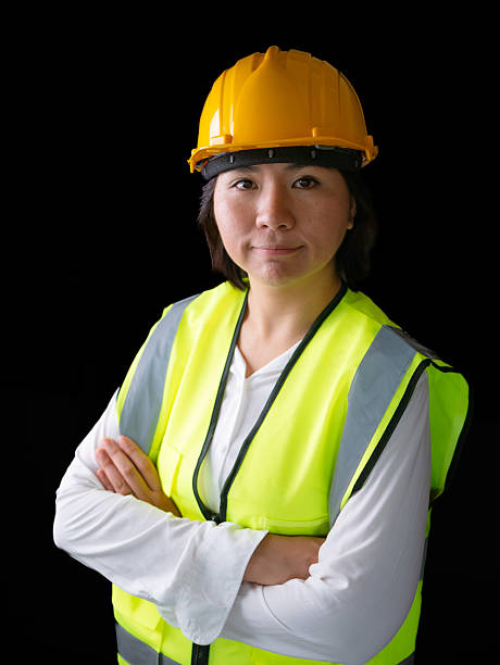 istock factory woman workers or technicians civil Engineer or Architecture project management smile at camera. 2217109336