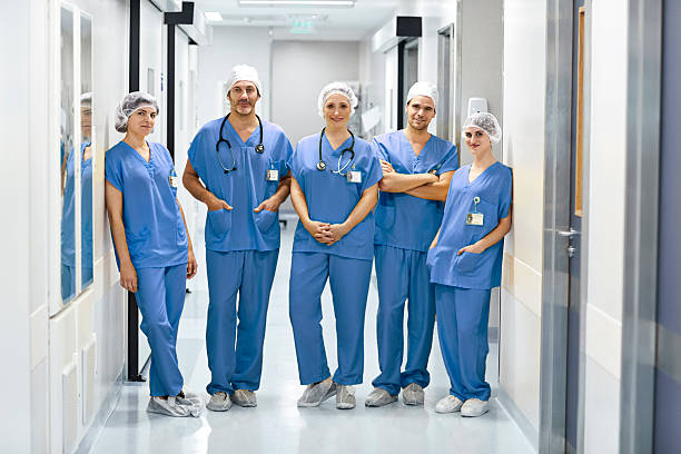 istock Confident surgeons standing in hospital corridor 2217109391