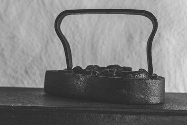 blacksmith's tongs on a large anvil