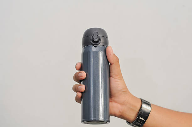istock a hand of man hold water thermos 2217112416