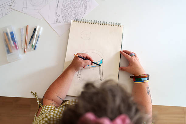 istock Woman sketching a table design in her workshop 2217114508