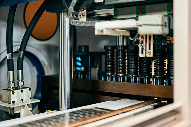 Industrial Machinery Components in a Factory Setting with Metal and Hydraulic Parts Close-up of industrial components with hydraulic and metal parts in a factory. sorter machine stock pictures, royalty-free photos & images