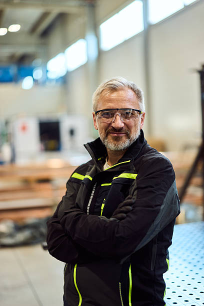 istock Confident Worker in Safety Gear at Modern Industrial Facility 2217115062
