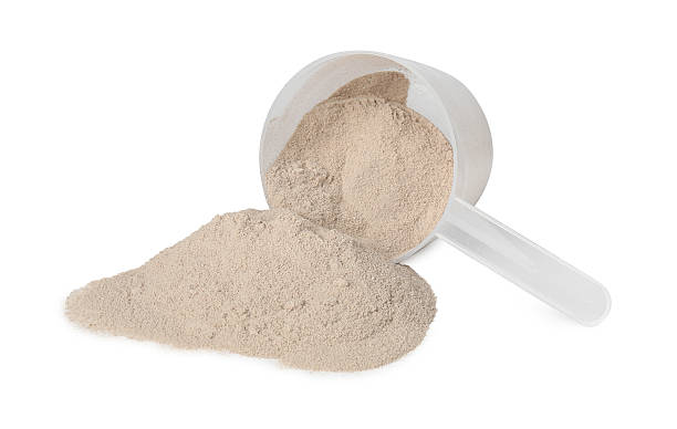 istock Protein powder and scoop isolated on white 2217115786