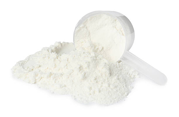 istock Protein powder and scoop isolated on white 2217115795