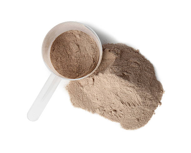 istock Protein powder and scoop isolated on white, top view 2217115813