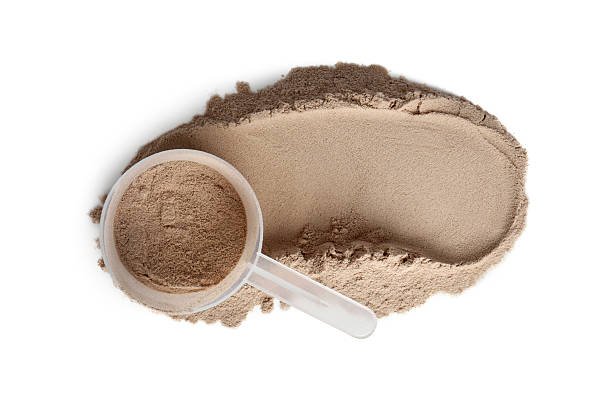 istock Protein powder and scoop isolated on white, top view 2217115818