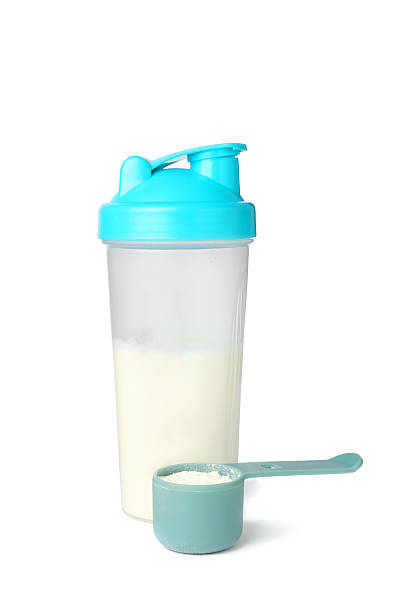 istock Protein powder, scoop and shaker isolated on white 2217115852