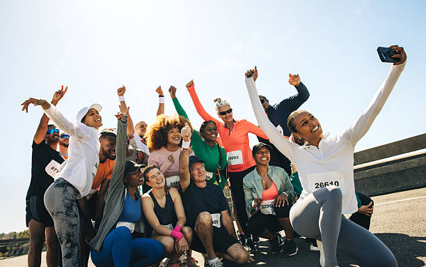 istock Group of diverse runners celebrating with a selfie after a race 2217116272