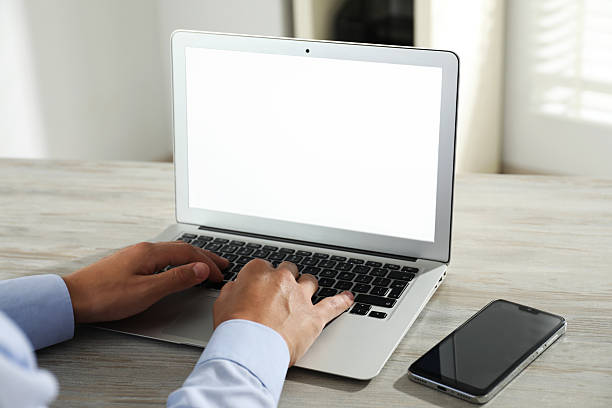 istock Businessman using laptop at wooden table, closeup. Modern technology 2217117352