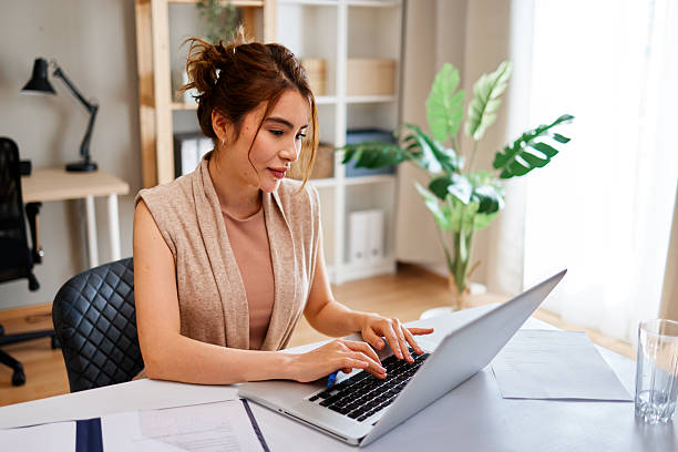 istock Young businesswoman working from home typing on laptop computer 2217117473
