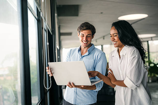 istock Multicultural professional businesspeople working together on research plan in boardroom. 2217117970