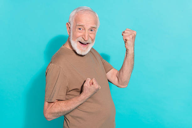 istock Profile side view portrait of attractive cheerful grey-haired man rejoicing having fun isolated over vibrant blue color background 2217117975