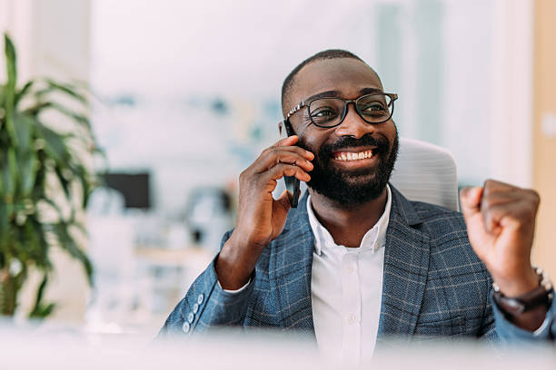 istock Businessman talking on the phone in the office. 2217119320