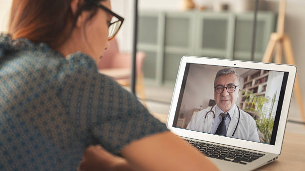 istock Patient making a conference video call with doctor on computer 2217122421