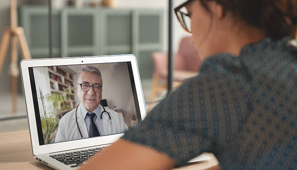 istock Patient making a conference video call with doctor on computer 2217122540