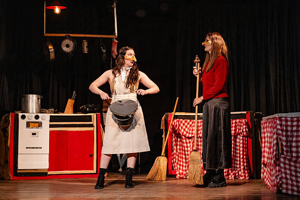 adult women perform a play in a theater