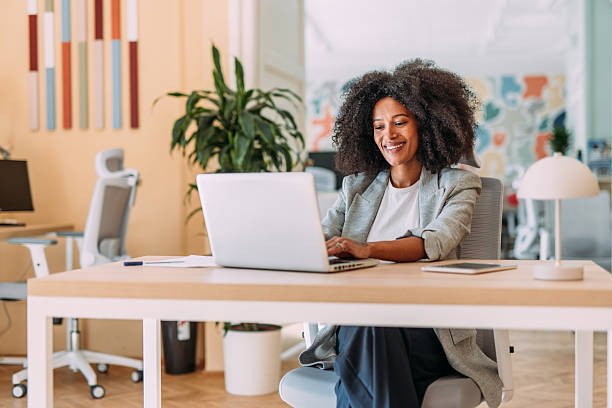 istock Successful businesswoman in modern office working on laptop. 2217126786