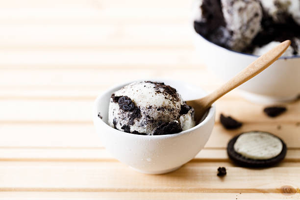 Cookies and cream ice cream in a white bowl.