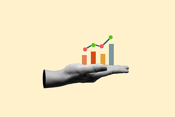 istock Human hand showing a graph bar with dots line chart on his hand with a colored background. Concept of business strategy. Collage art 2217127295