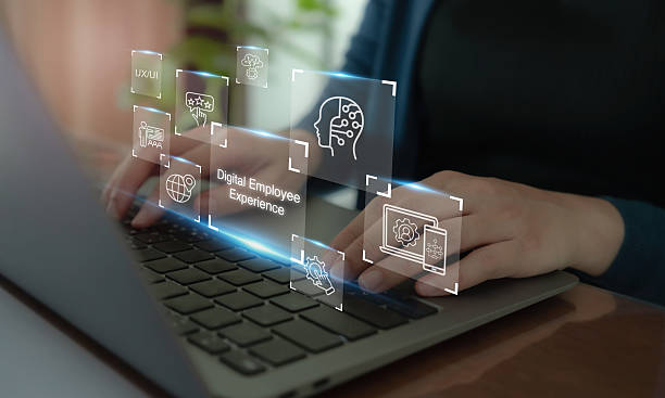 istock Digital Employee Experience concept.Hands typing on a laptop keyboard with futuristic digital interface such as digital employee experience,  digital tools, technologies and platforms in organization. 2217127499