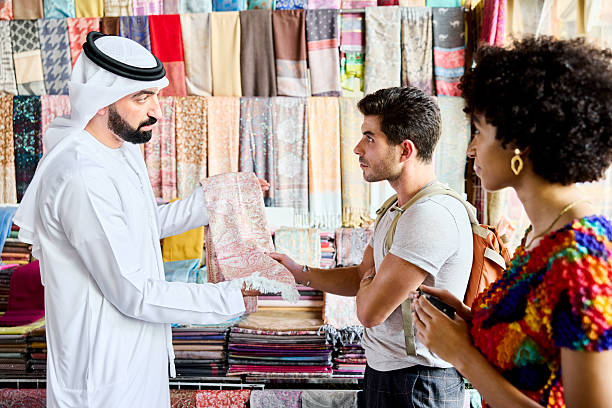 istock Local Muslim guide showing shawl to tourist 2217128409