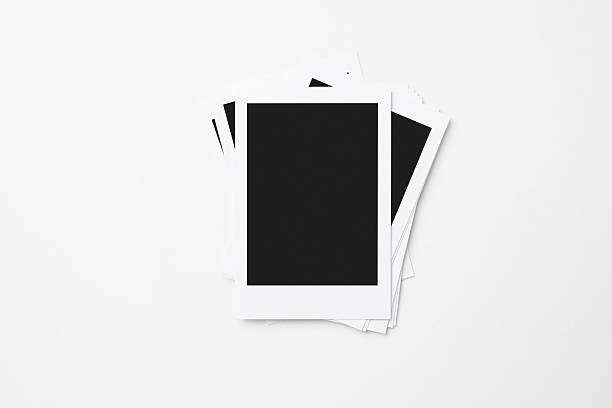 istock A stack of blank polaroid photo papers on a white background. Mockup, template, or copy space. Instant camera photo print frame 2217128936