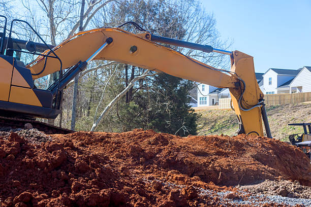 istock Excavator working on construction site in residential area during sunny hours 2217129128
