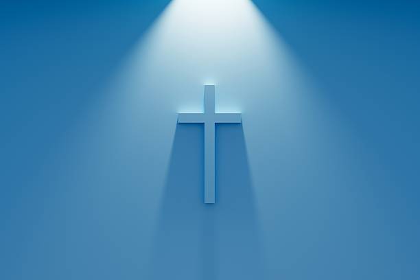 istock Glowing Cross 3d banner. Religion concept. Rays of light from above, blue background 2217130251