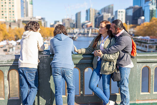 istock Happy family hugging while on holidays in Melbourne, Australia 2217130394
