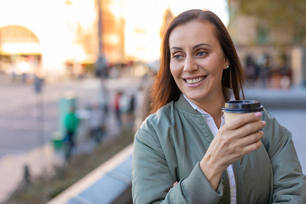 istock Middle aged woman with a coffee in Melbourne 2217130415