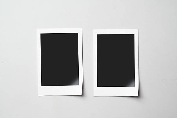 istock Two blank polaroid photo papers on a white background. Mockup, template, or copy space. Instant camera photo print frame 2217132180